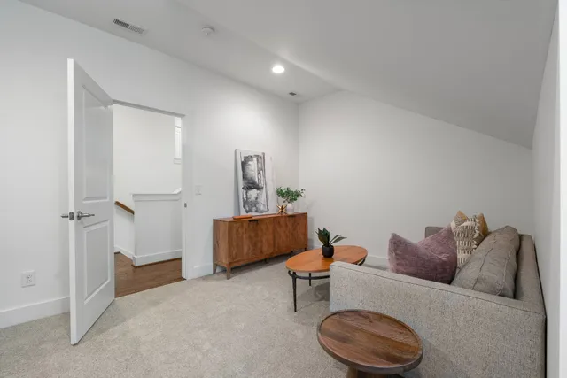 a view of a big room with a ceiling fan