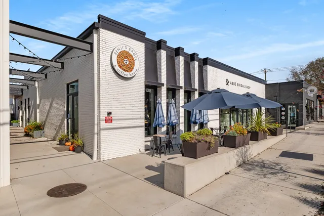 an aerial view of residential houses with outdoor space