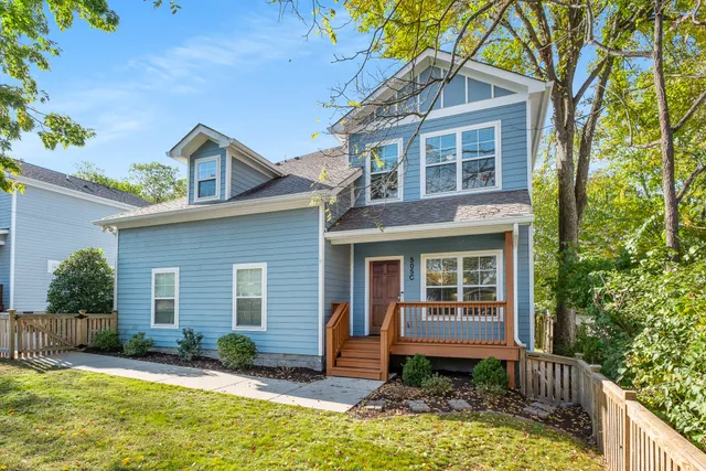 a living room with kitchen island furniture and a kitchen view