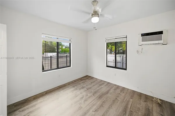 a view of an empty room with a window