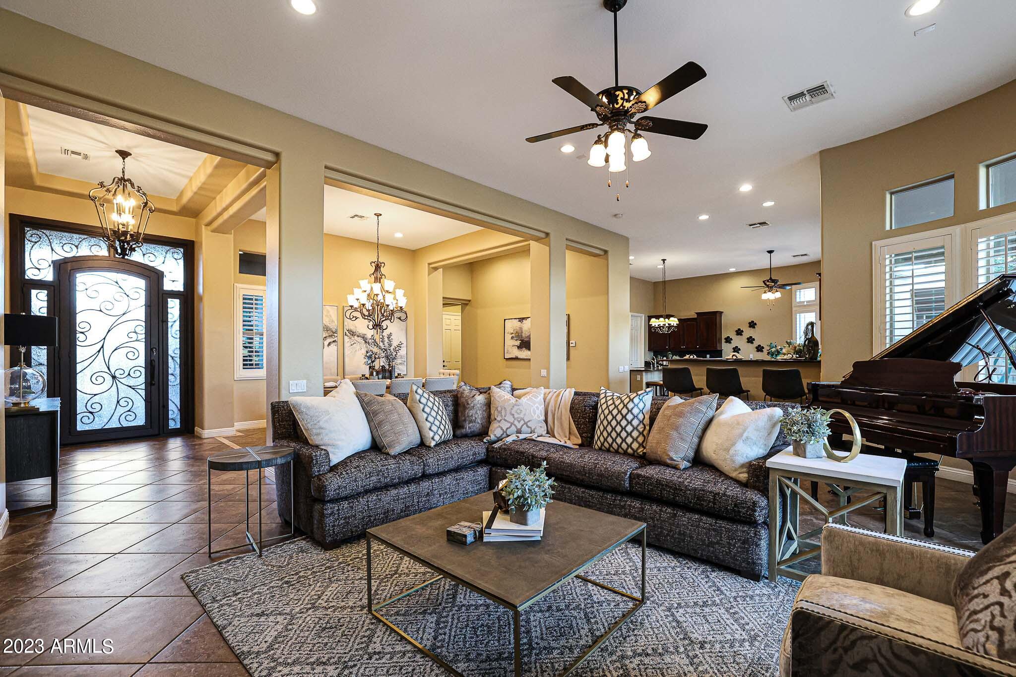 4935 West Yearling Road Phoenix, AZ 85083 - Photo 15 of 57 a living room with furniture and a large window