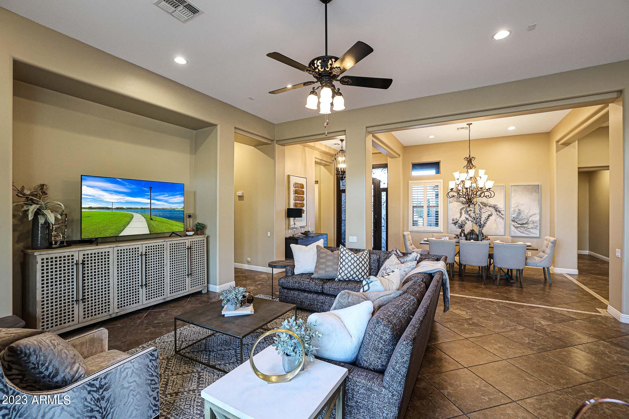 4935 West Yearling Road Phoenix, AZ 85083 - Photo 16 of 57 a living room with furniture and a window