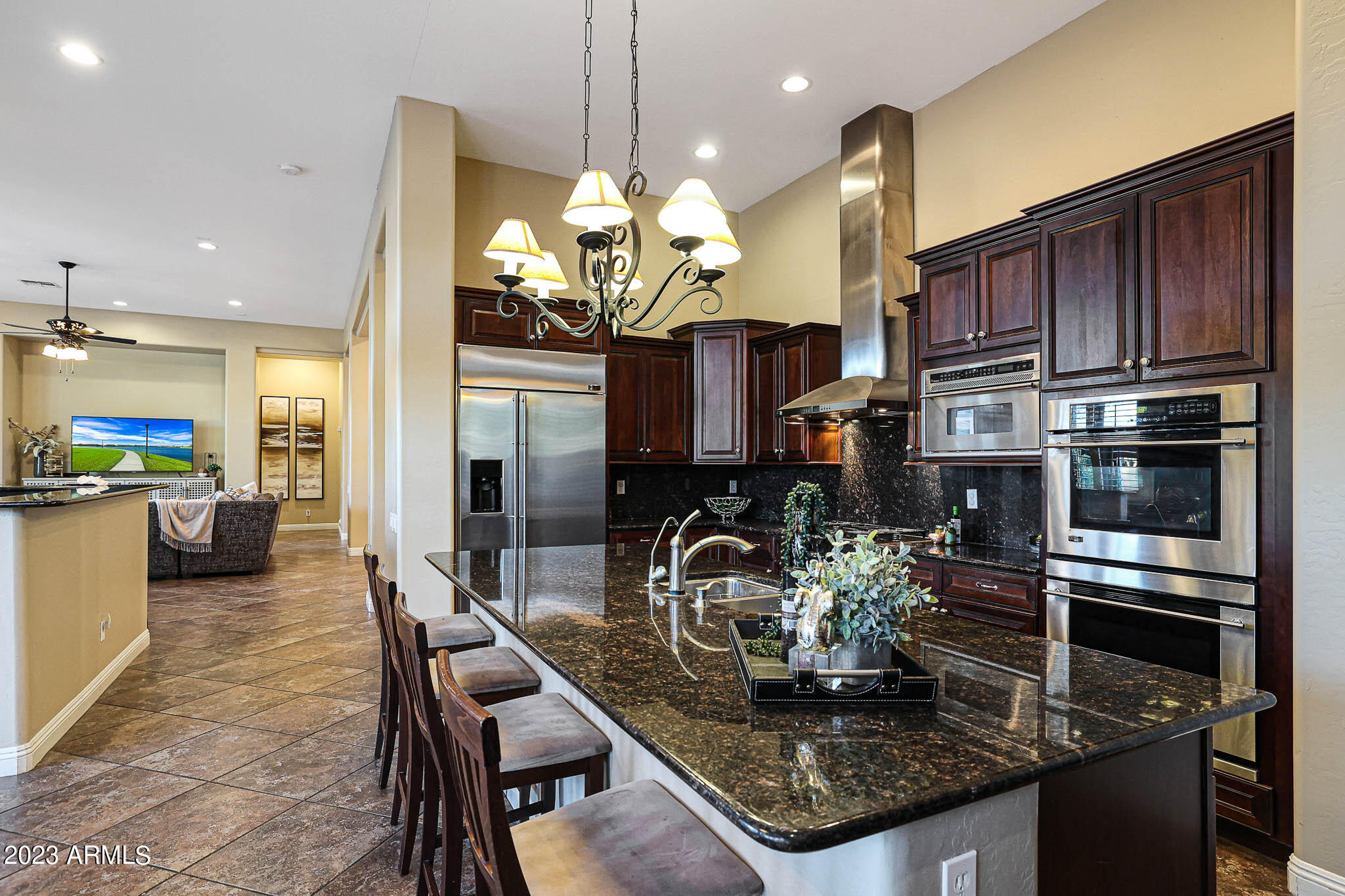 4935 West Yearling Road Phoenix, AZ 85083 - Photo 21 of 57 a kitchen with stainless steel appliances granite countertop a sink refrigerator and cabinets