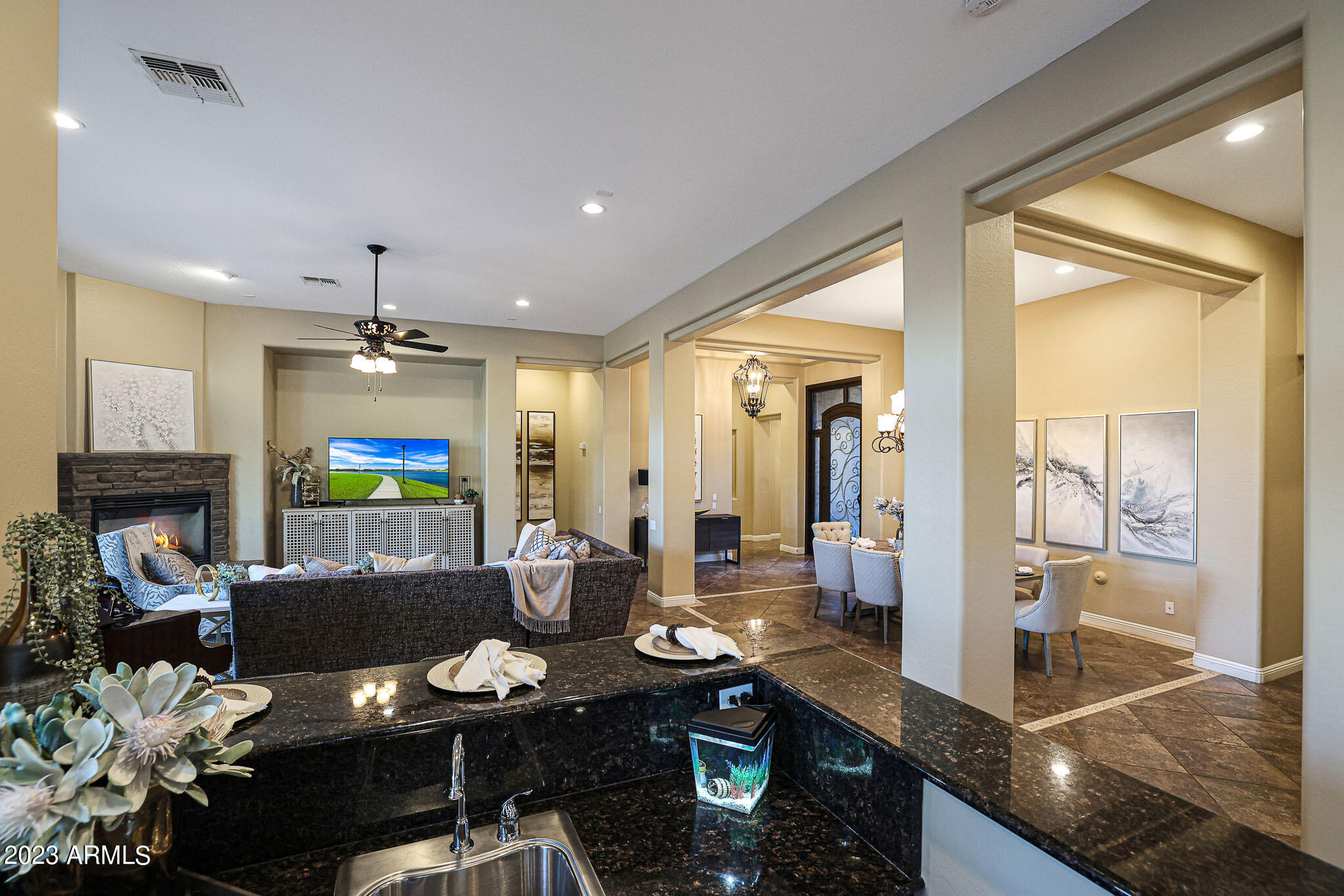 4935 West Yearling Road Phoenix, AZ 85083 - Photo 24 of 57 a living room with fireplace furniture and a flat screen tv