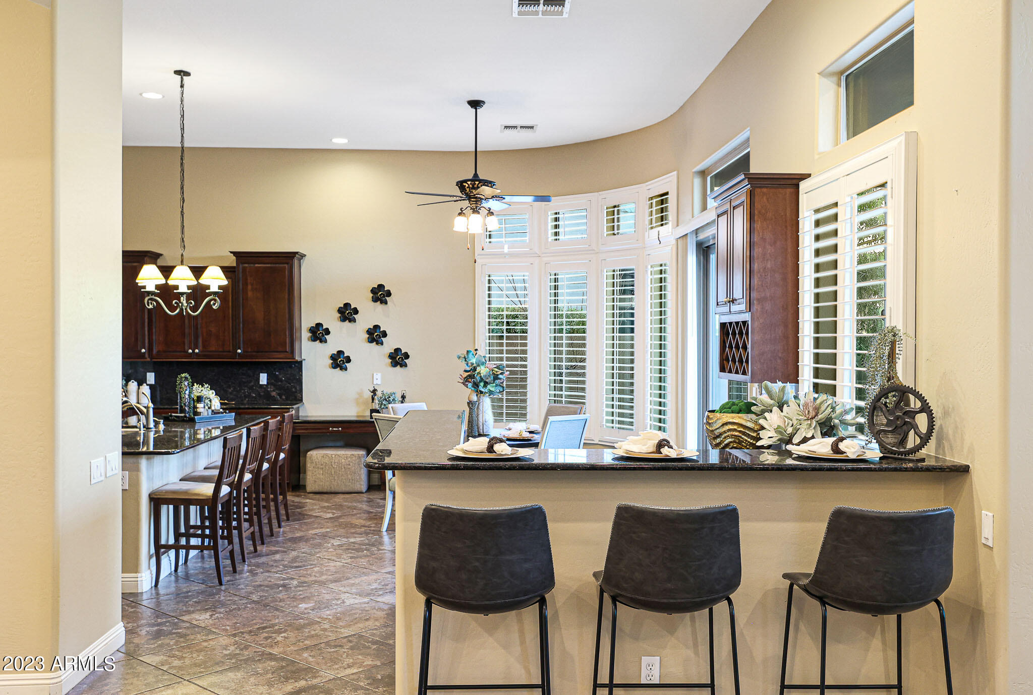 4935 West Yearling Road Phoenix, AZ 85083 - Photo 25 of 57 a view of a dining room with furniture and chandelier