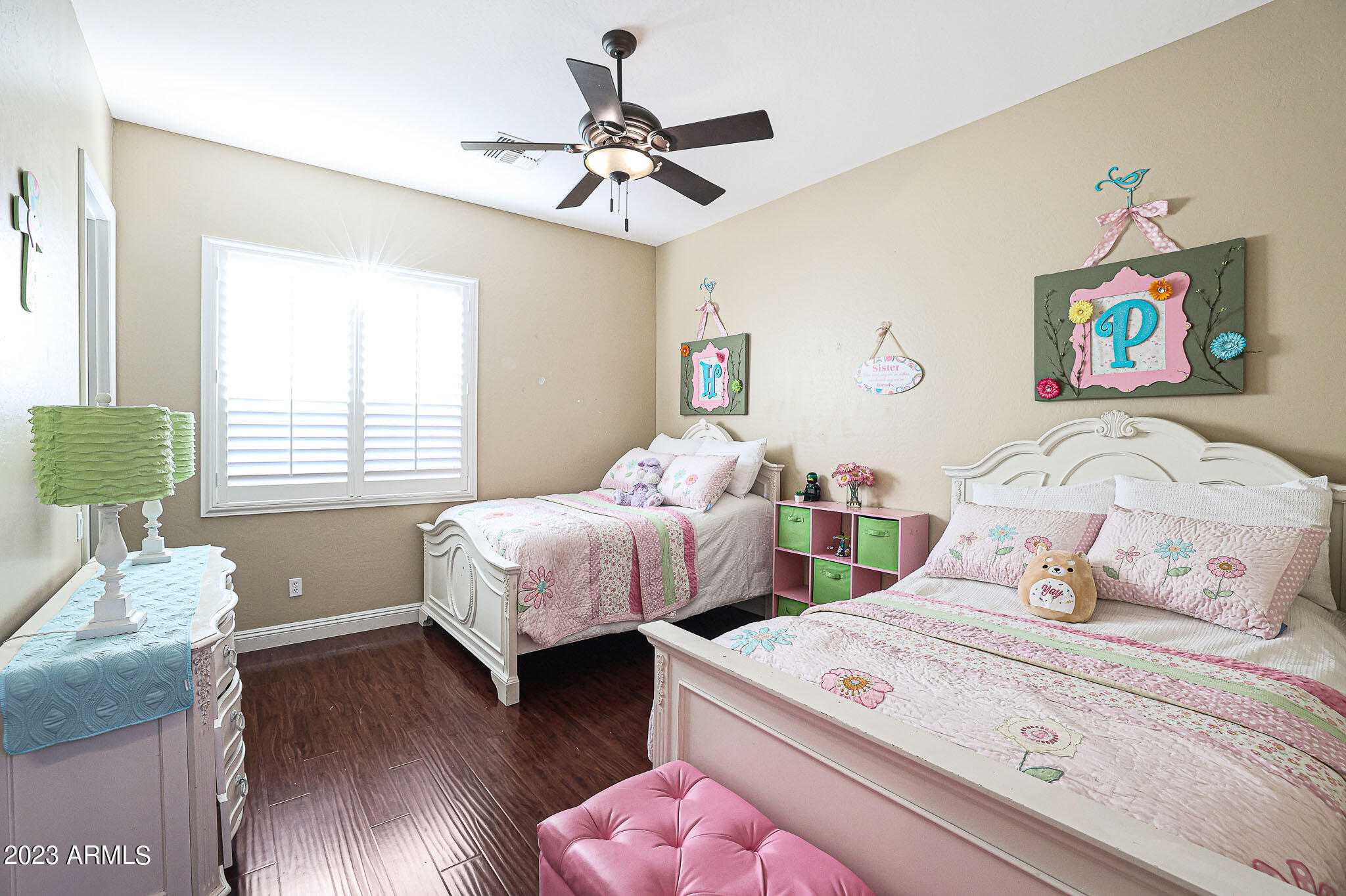 4935 West Yearling Road Phoenix, AZ 85083 - Photo 31 of 57 a bedroom with two beds and a wooden floor