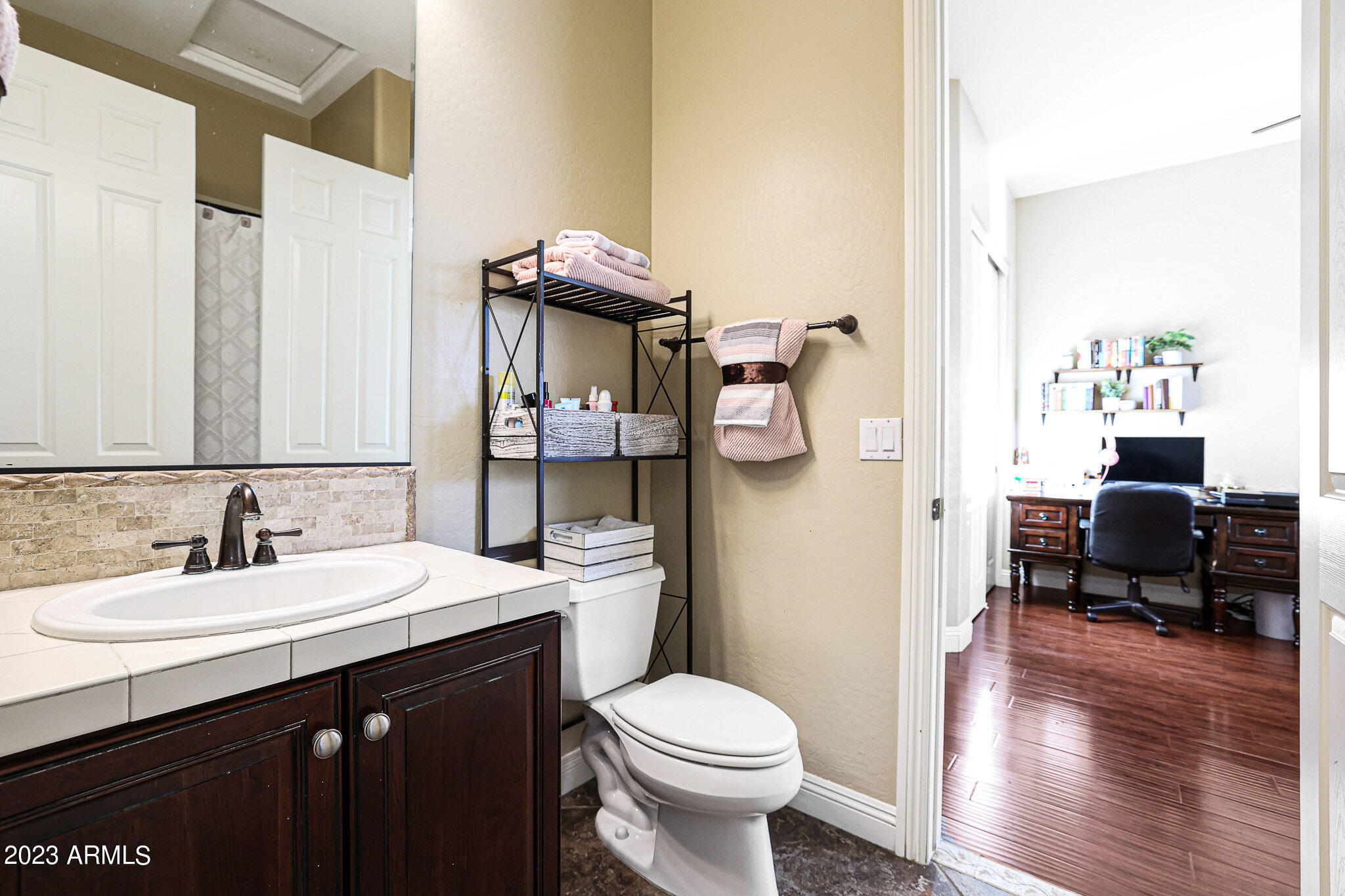 4935 West Yearling Road Phoenix, AZ 85083 - Photo 32 of 57 a bathroom with a sink toilet and shower