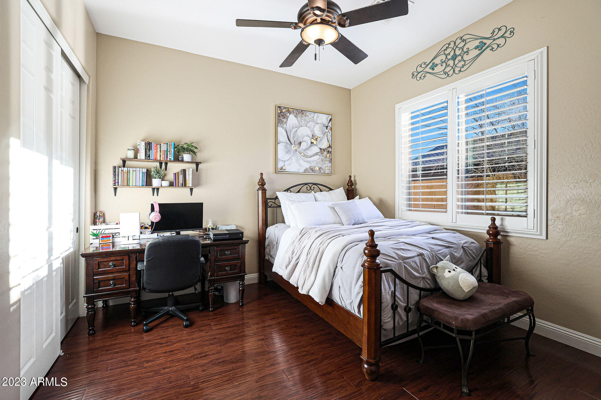 4935 West Yearling Road Phoenix, AZ 85083 - Photo 33 of 57 a bedroom with a bed and a desk