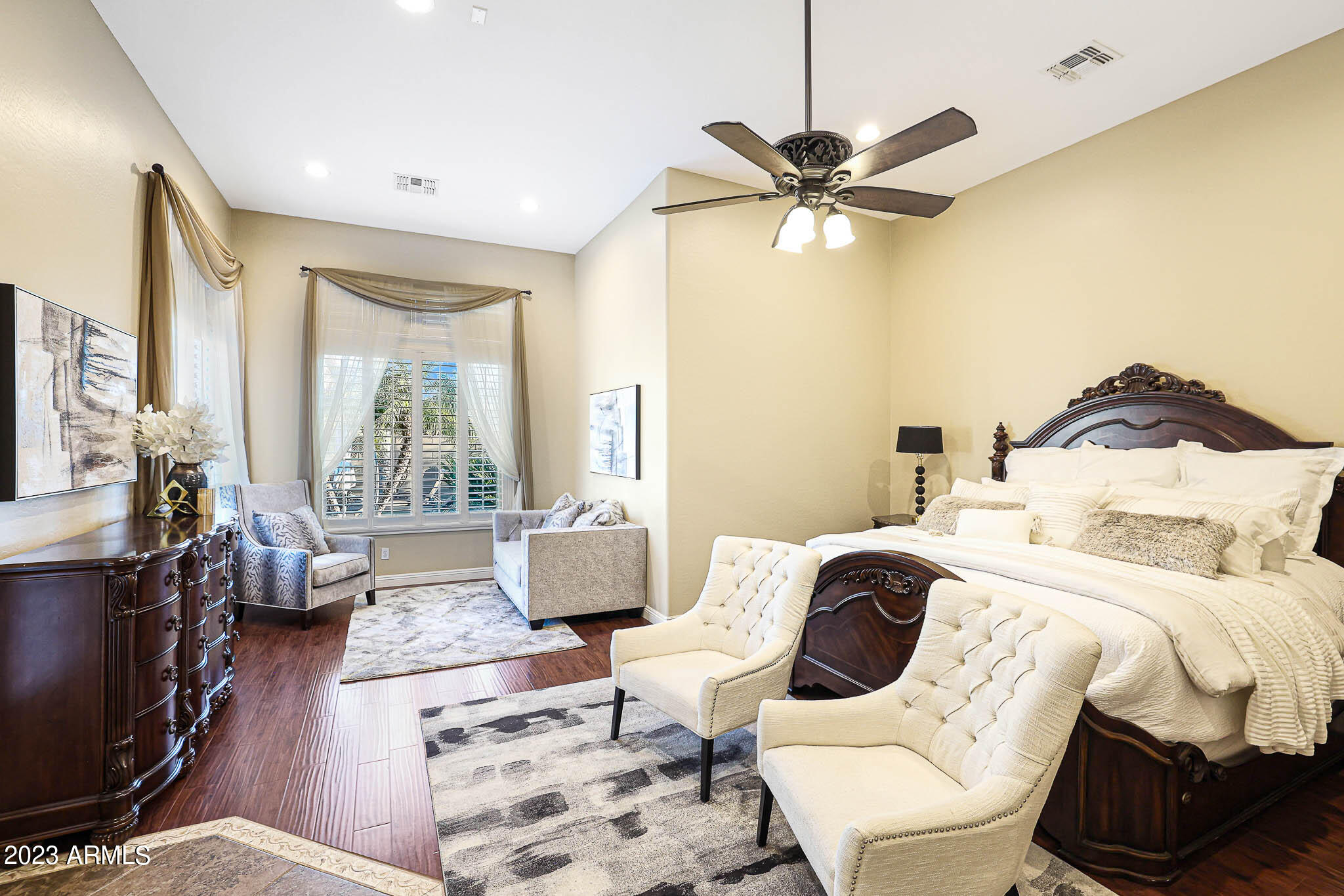 4935 West Yearling Road Phoenix, AZ 85083 - Photo 34 of 57 a bedroom with a bed and wooden floor