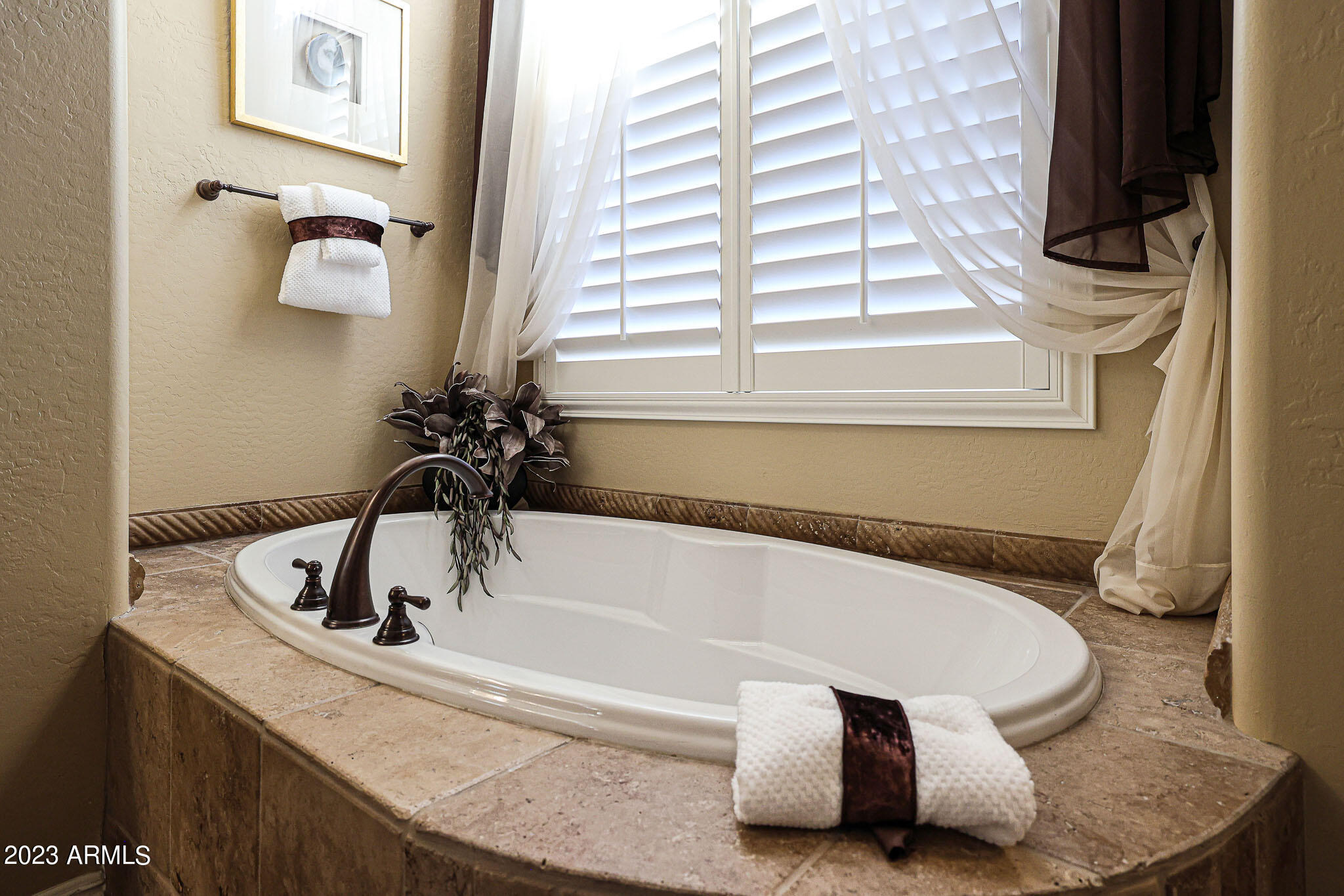 4935 West Yearling Road Phoenix, AZ 85083 - Photo 39 of 57 a bath tub sitting next to a window