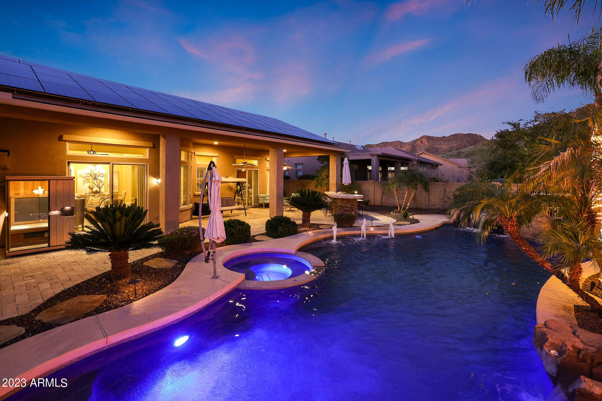 4935 West Yearling Road Phoenix, AZ 85083 - Photo 41 of 57 a view of a patio with lawn chairs under an umbrella