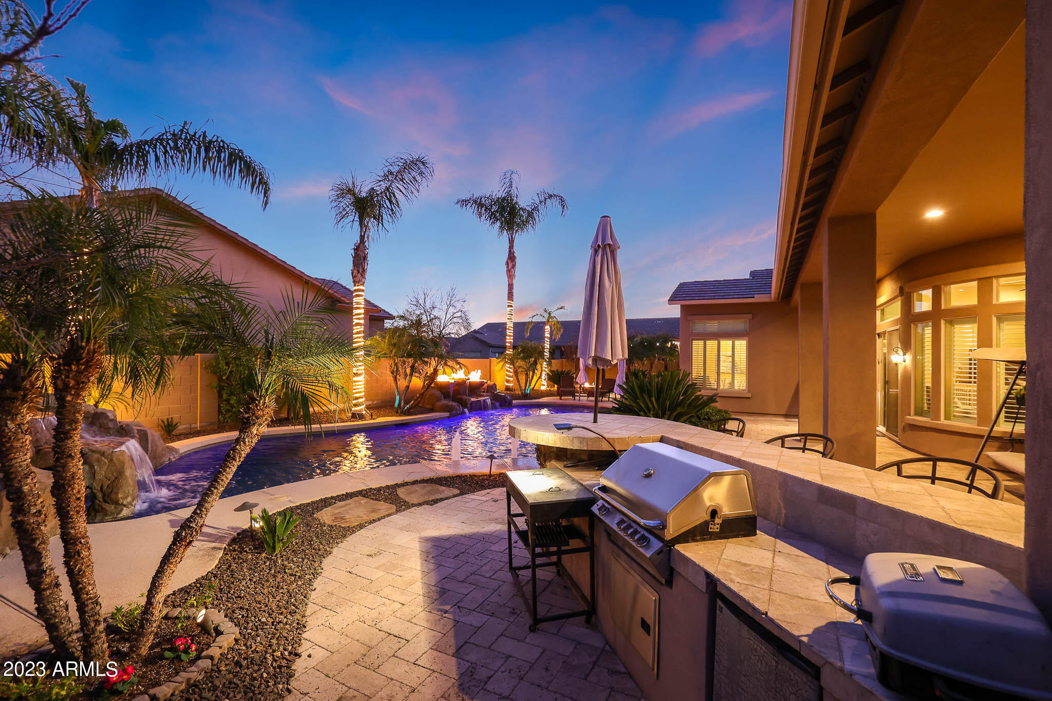4935 West Yearling Road Phoenix, AZ 85083 - Photo 44 of 57 a view of a chairs and table in patio with a barbeque