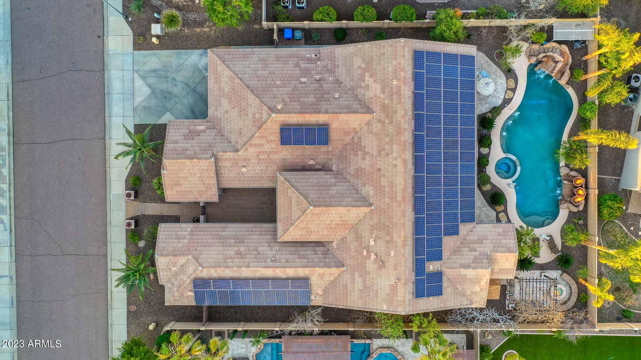 4935 West Yearling Road Phoenix, AZ 85083 - Photo 9 of 57 a aerial view of a house with swimming pool and large trees