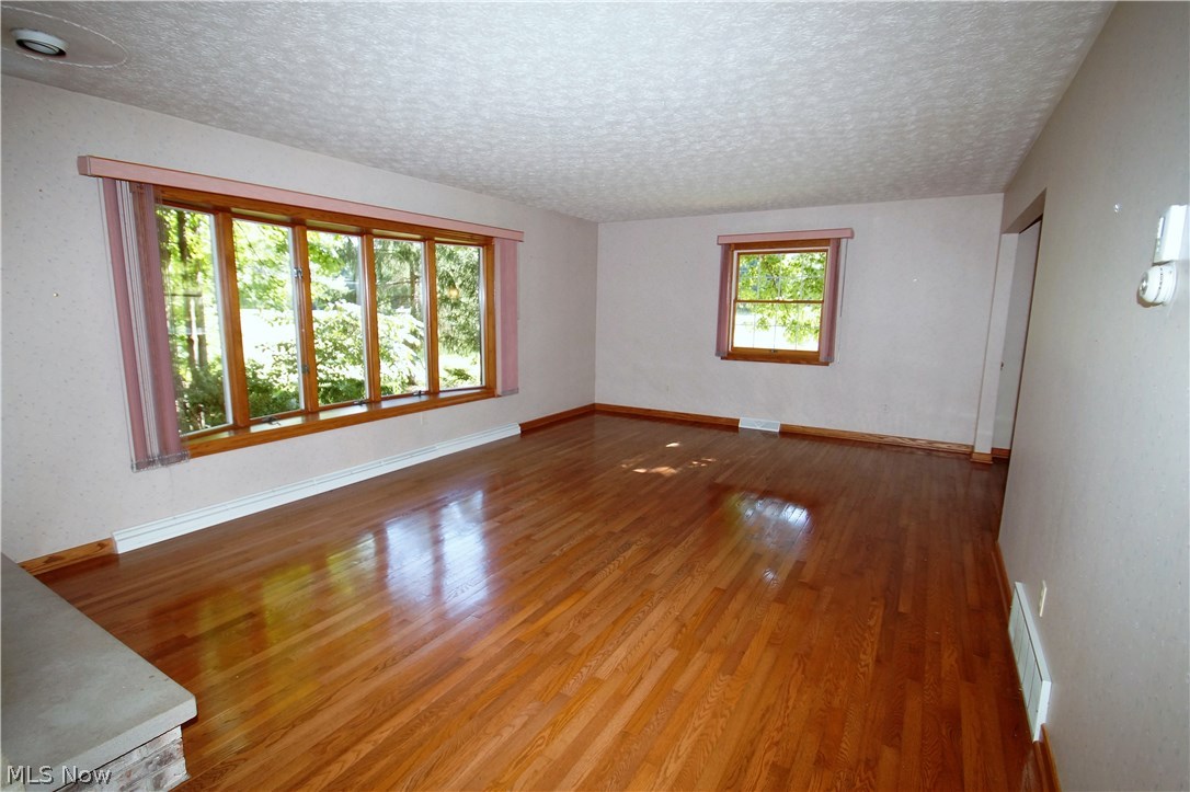 4202 Laubert Road Atwater, OH 44201 - Photo 6 of 31 very spacious inviting living room with well cared for Hardwood floors.