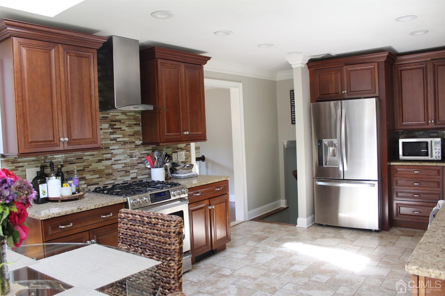 10 Fishel Road Edison, NJ 08820 - Photo 6 of 11 a kitchen with stainless steel appliances granite countertop a refrigerator stove and sink