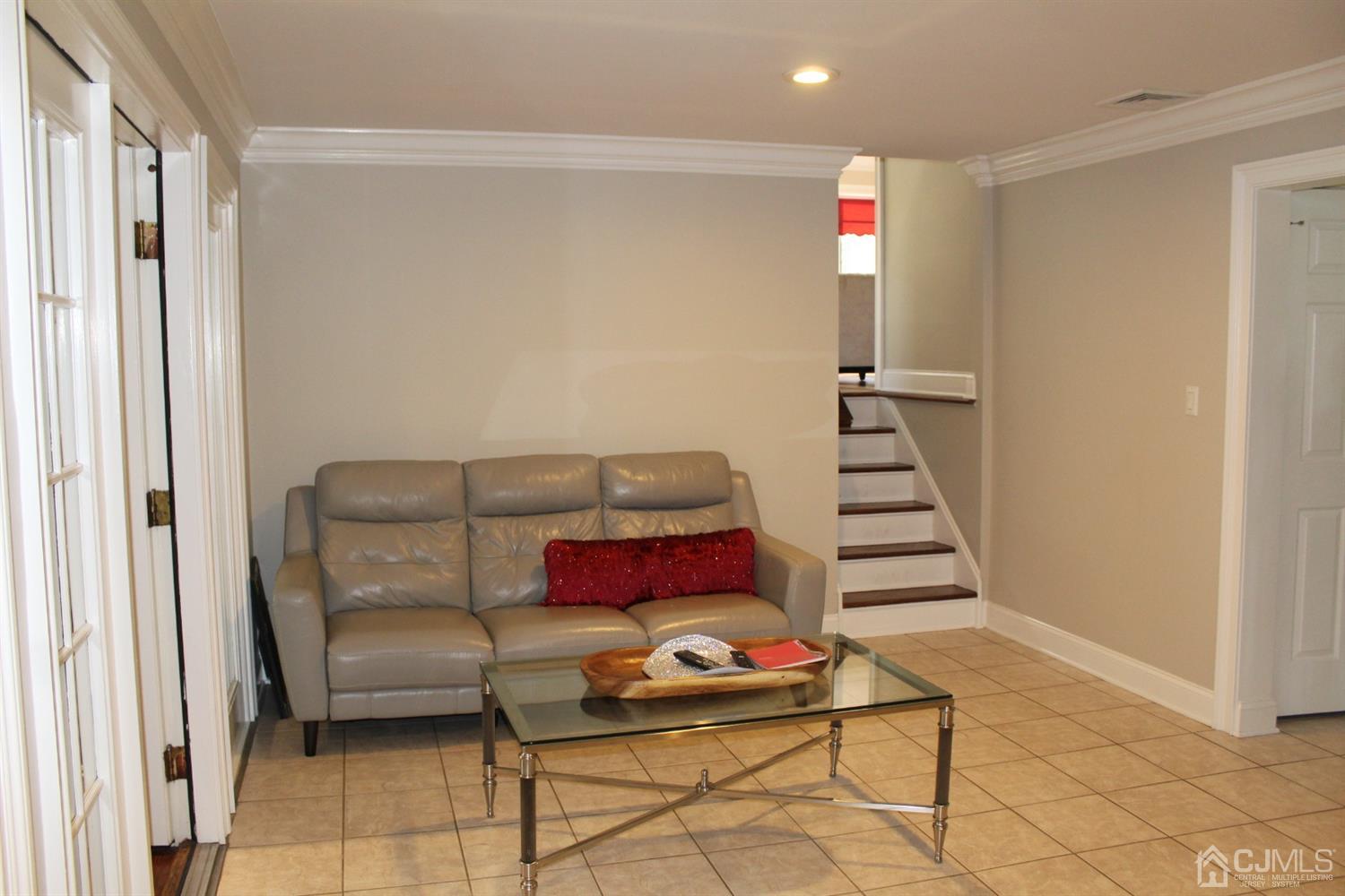 10 Fishel Road Edison, NJ 08820 - Photo 7 of 11 a living room with furniture and a potted plant