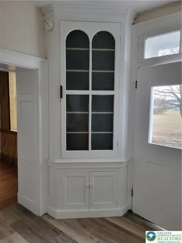 a view of front door with wooden floor