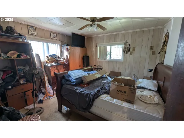 a kitchen with a sink refrigerator and cabinets