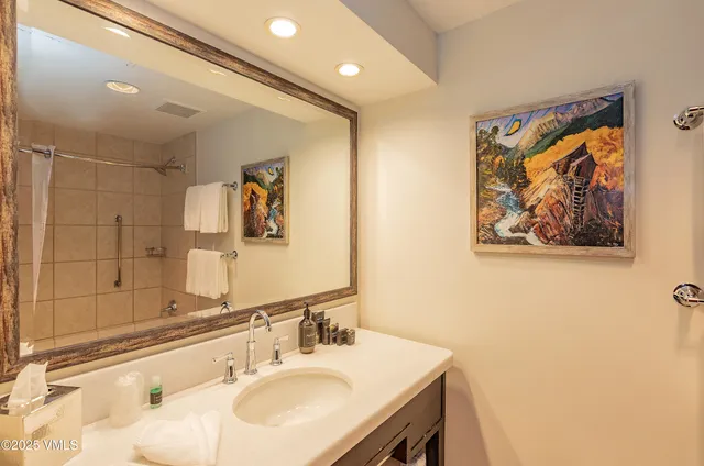 a bathroom with a bathtub and shower