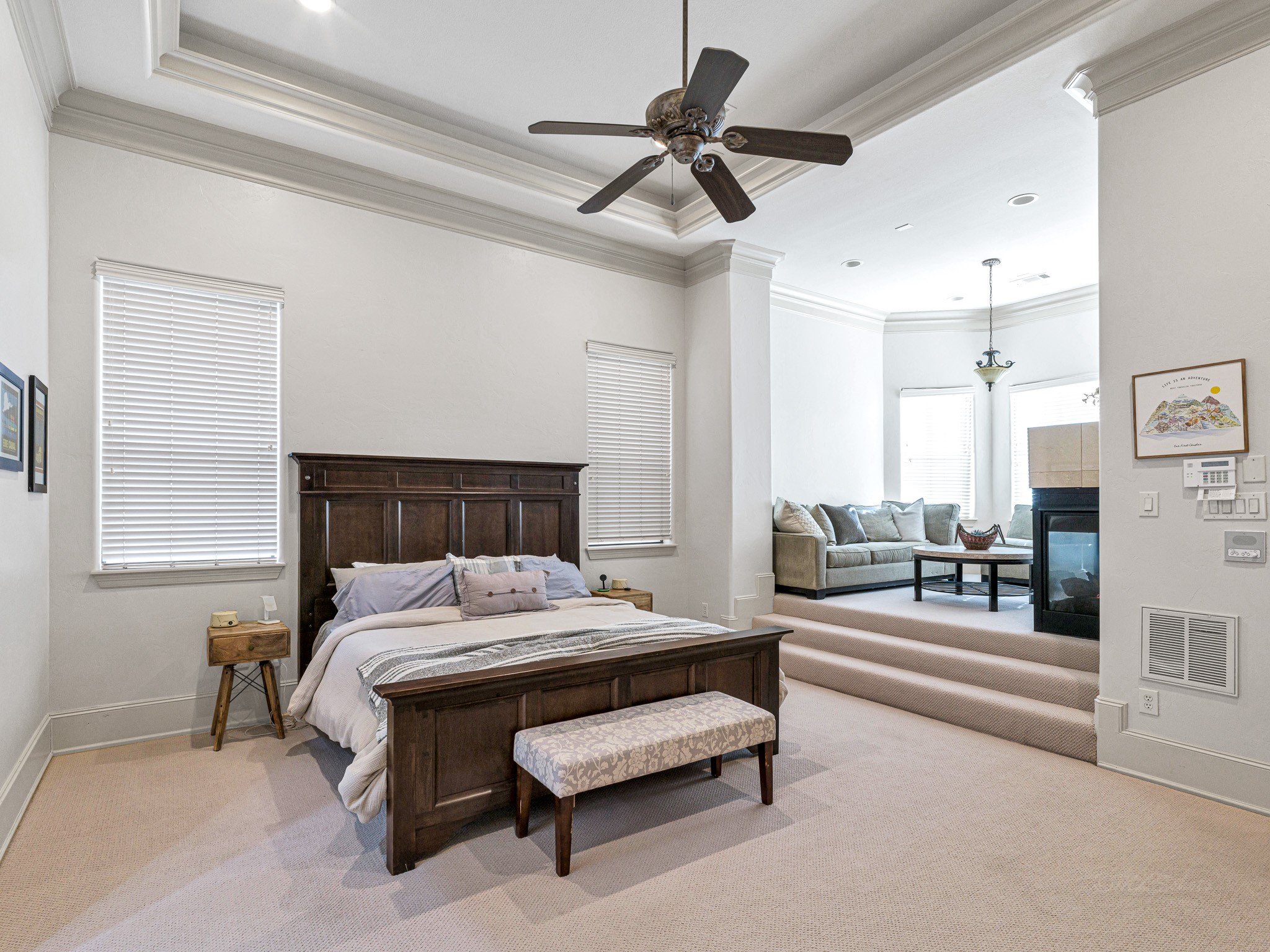 4614 Inker Street Houston, TX 77007 - Photo 20 of 36 This spacious primary bedroom includes an oversized sitting area and a double-sided fireplace and an en suite primary bathroom.