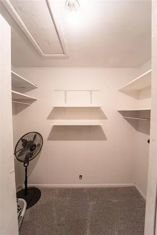 a view of staircase with white walls