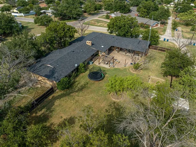 an aerial view of house with yard