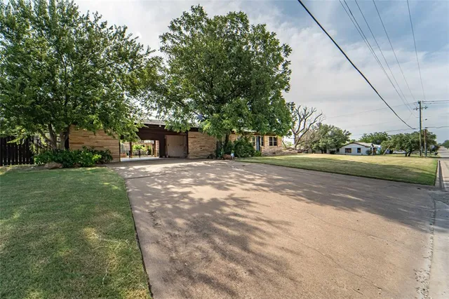 a backyard of a house with lots of green space