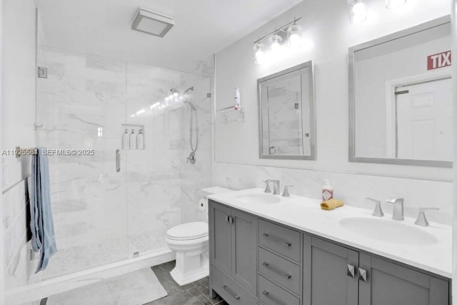 5500 Buchanan Street Hollywood, FL 33021 - Photo 13 of 24 a bathroom with a sink a toilet and shower
