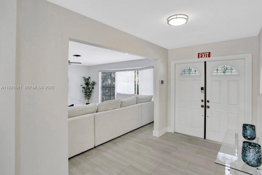 5500 Buchanan Street Hollywood, FL 33021 - Photo 16 of 24 a living room with furniture and a window