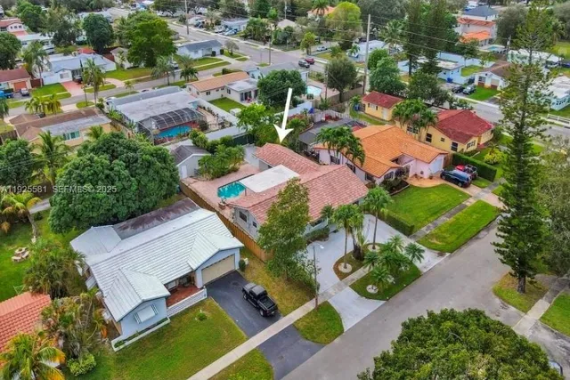 an aerial view of a house with a garden