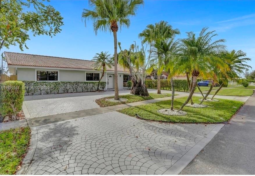 5500 Buchanan Street Hollywood, FL 33021 - Photo 3 of 24 a front view of house with yard and green space