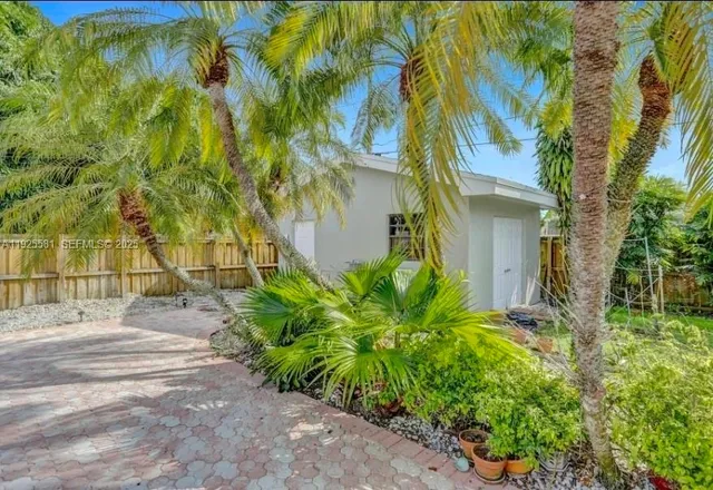 a backyard of a house with lots of green space