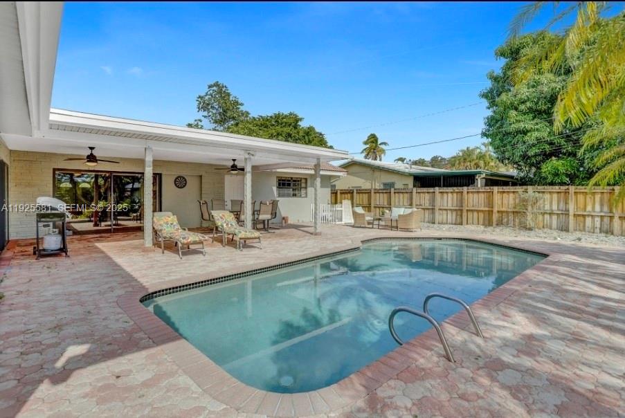 5500 Buchanan Street Hollywood, FL 33021 - Photo 8 of 24 a view of a house with swimming pool and sitting area