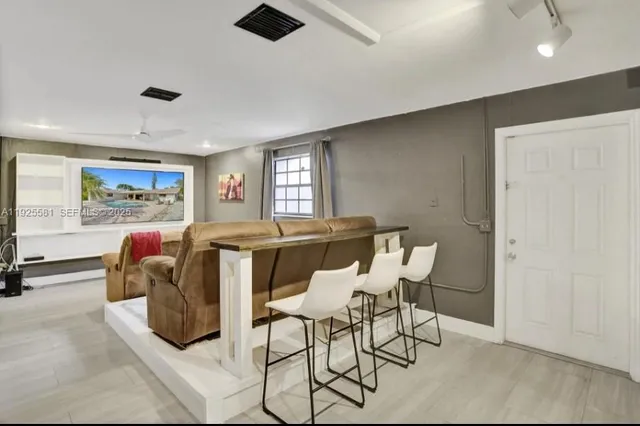 a living room with furniture and a window