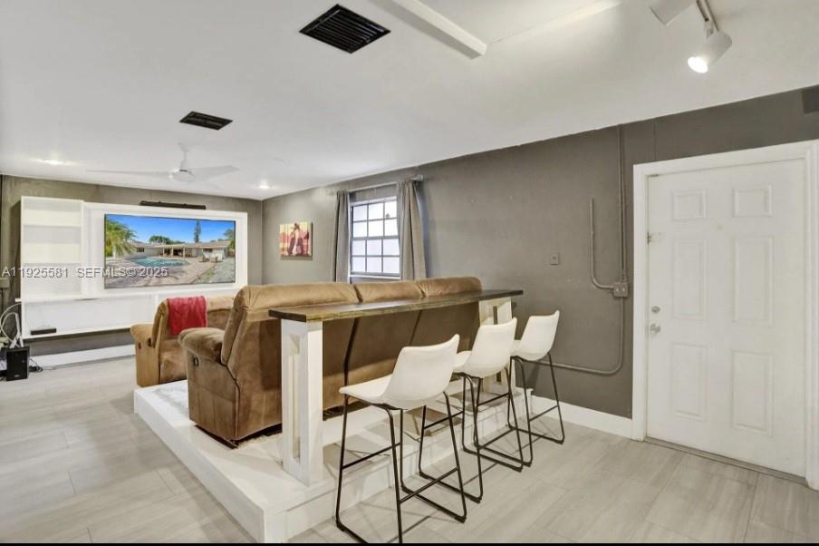 5500 Buchanan Street Hollywood, FL 33021 - Photo 10 of 24 a living room with furniture and a window