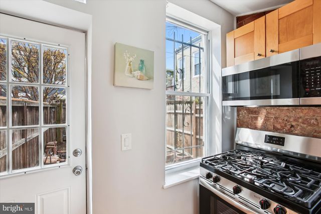 a kitchen with a stove and a microwave