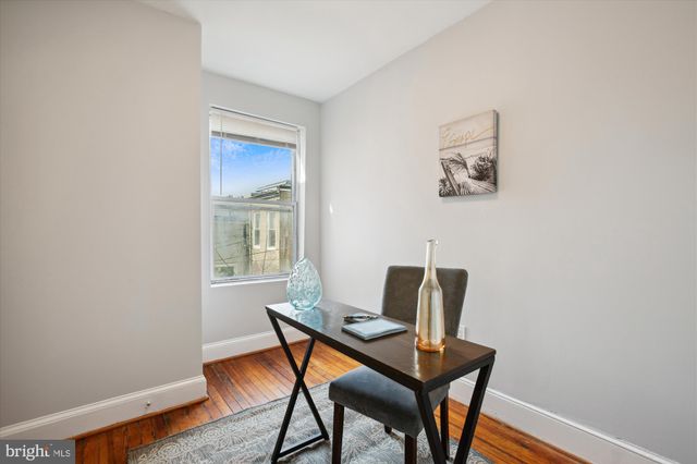 a workspace with furniture and a window