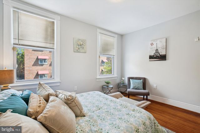 a bedroom with a bed and furniture