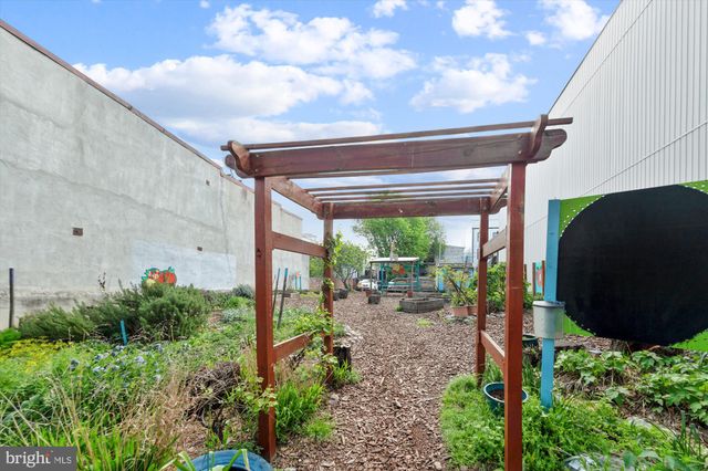 a view of a street with a building in the background