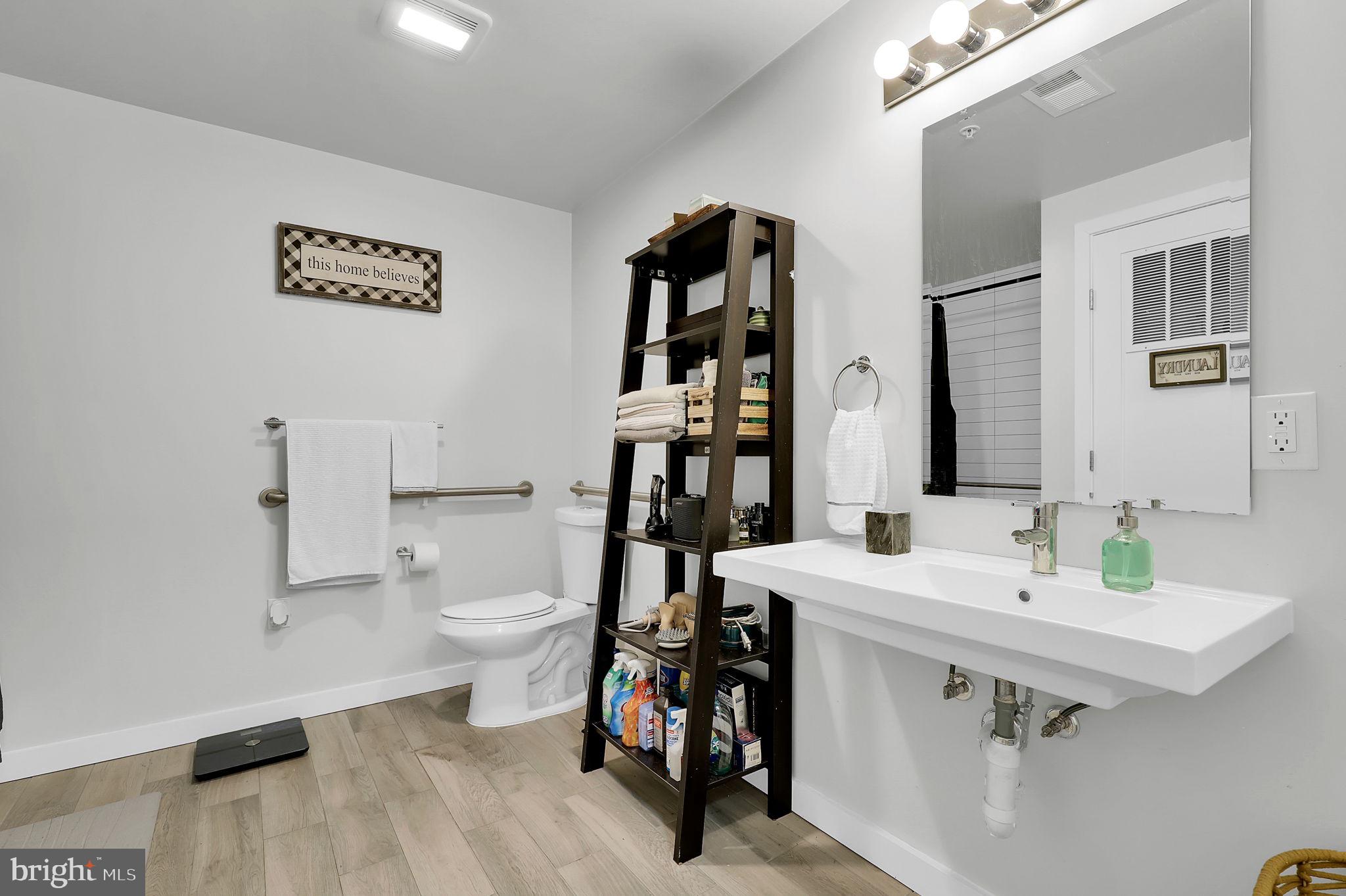 700 Roeder Road, Unit 101 Silver Spring, MD 20910 - Photo 9 of 16 a bathroom with a sink and a toilet