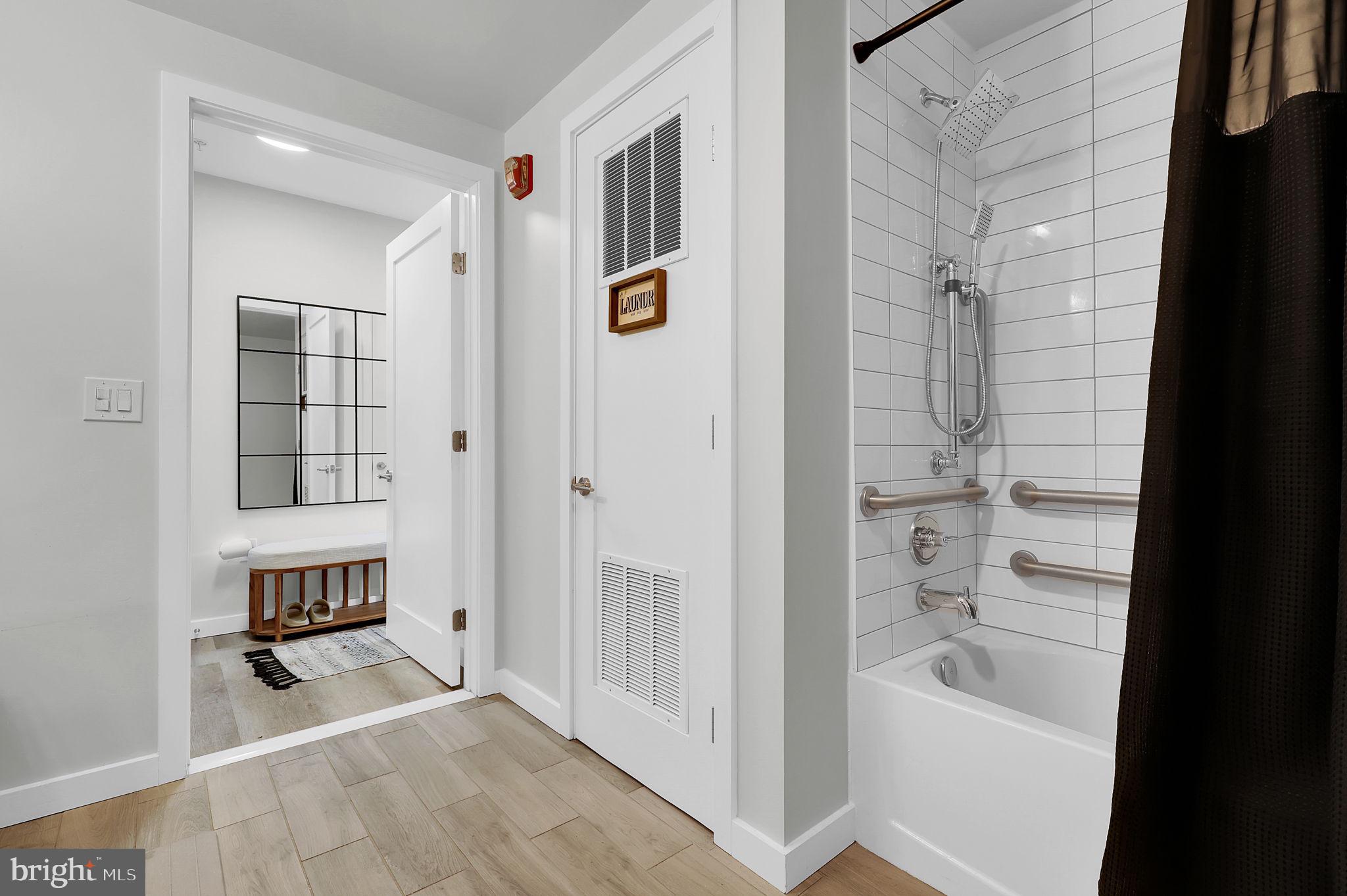 700 Roeder Road, Unit 101 Silver Spring, MD 20910 - Photo 10 of 16 a bathroom with a bathtub and shower