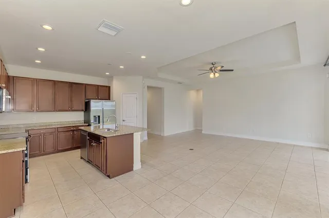 a kitchen with stainless steel appliances a sink and cabinets