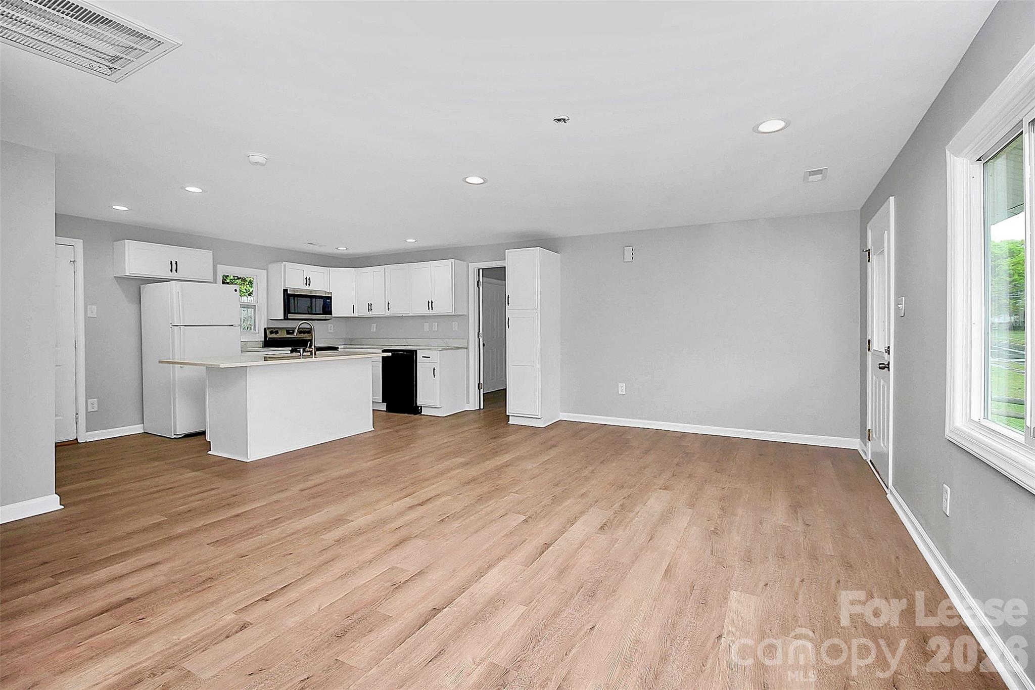 315 South Ransom Street Gastonia, NC 28052 - Photo 2 of 18 a view of kitchen with wooden floor and electronic appliances