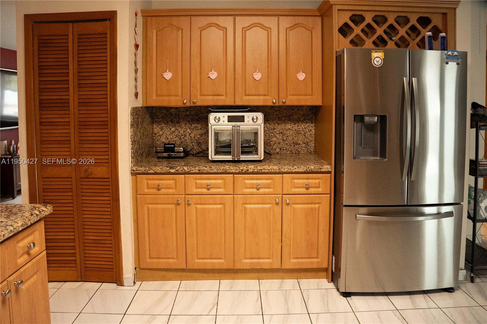3700 Southwest 139th Avenue Miami, FL 33175 - Photo 13 of 40 a kitchen with stainless steel appliances granite countertop a refrigerator and a stove top oven
