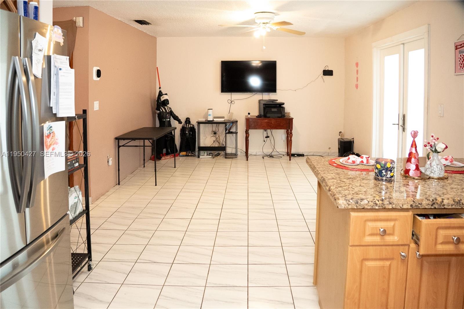 3700 Southwest 139th Avenue Miami, FL 33175 - Photo 15 of 40 a living room with furniture and a flat screen tv