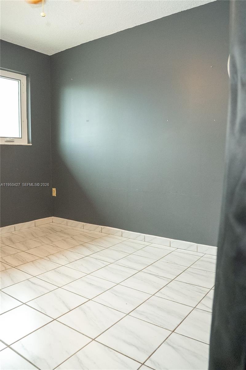 3700 Southwest 139th Avenue Miami, FL 33175 - Photo 18 of 40 a bedroom with a bed