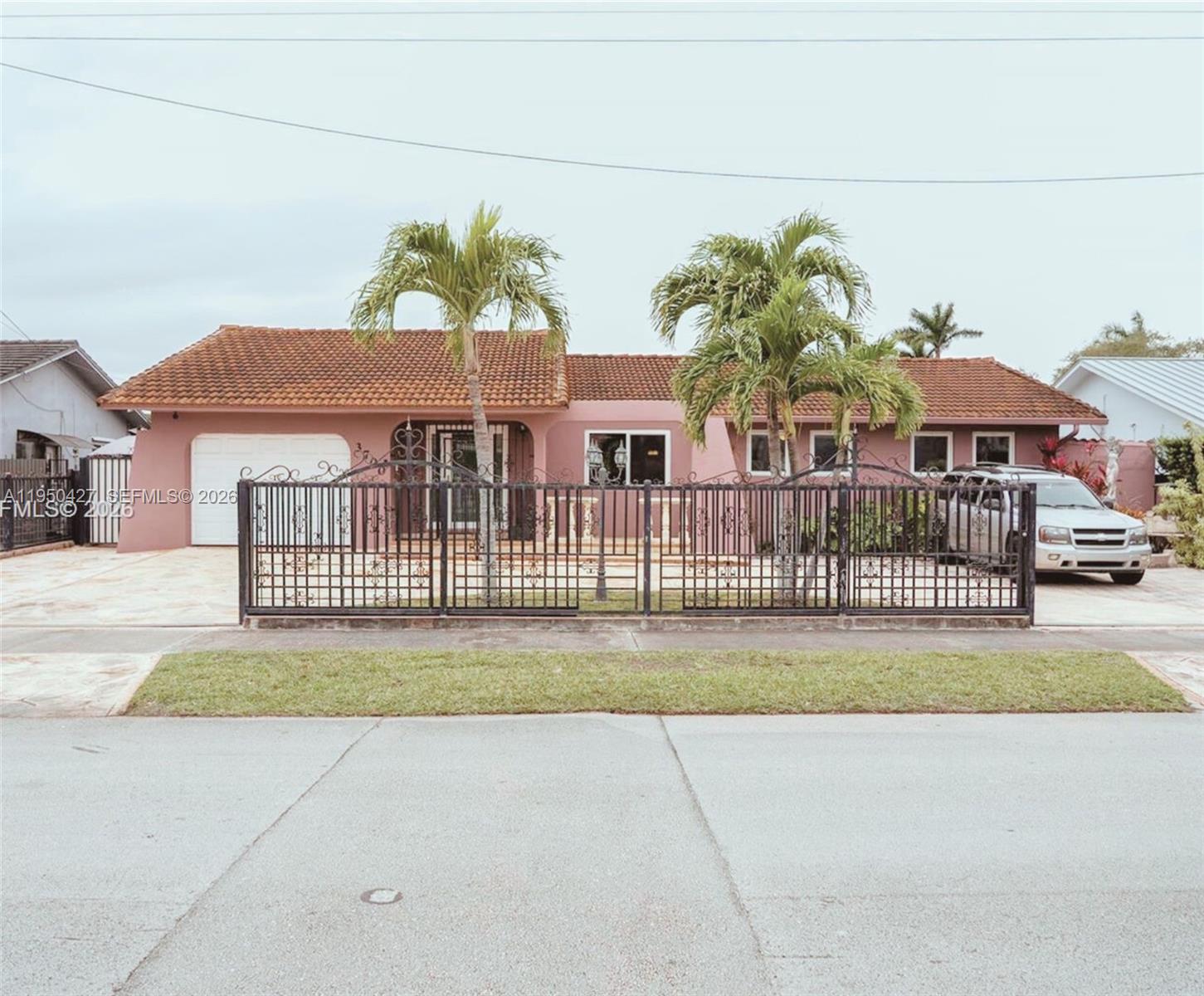 3700 Southwest 139th Avenue Miami, FL 33175 - Photo 2 of 40 a view of a house with a yard and table and chair
