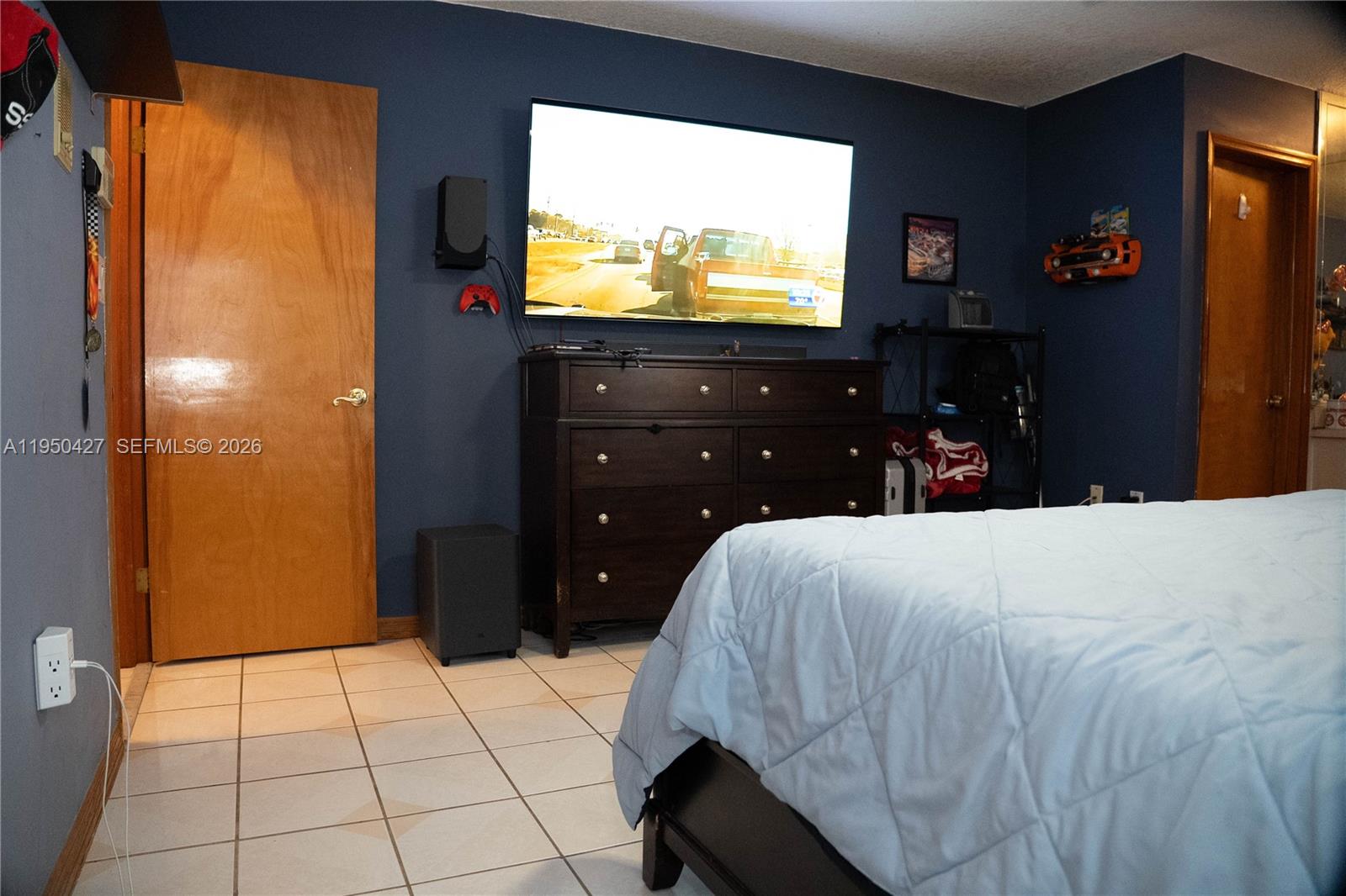 3700 Southwest 139th Avenue Miami, FL 33175 - Photo 24 of 40 a bedroom with a bed and a flat screen tv