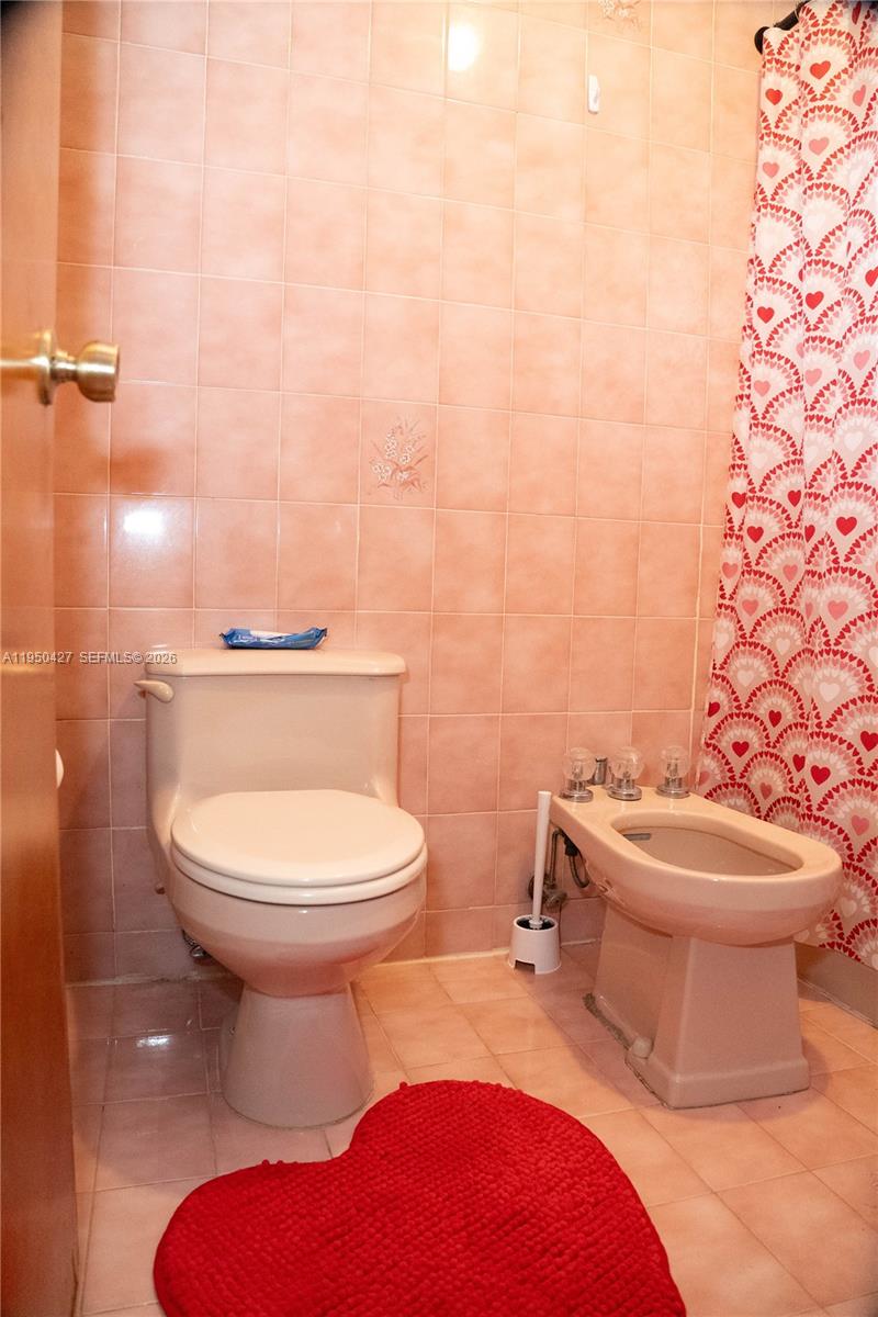 3700 Southwest 139th Avenue Miami, FL 33175 - Photo 26 of 40 a bathroom with a toilet a sink and a mirror