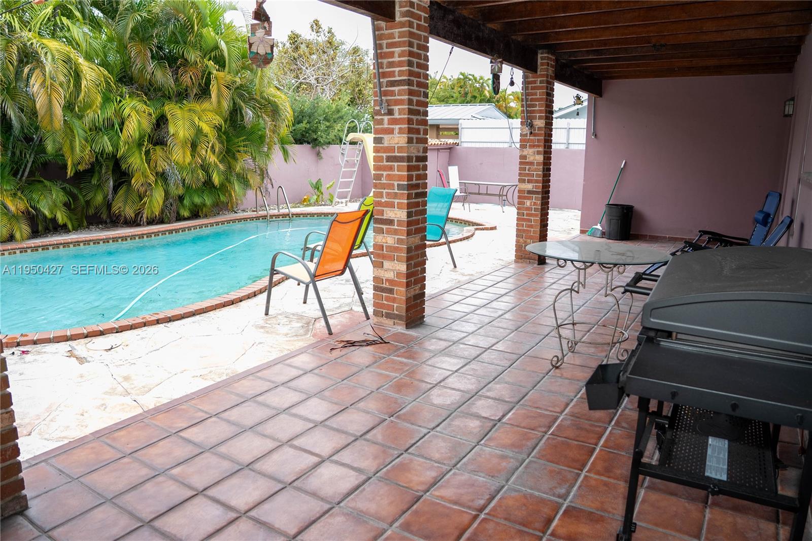 3700 Southwest 139th Avenue Miami, FL 33175 - Photo 32 of 40 a view of a chairs and table in patio